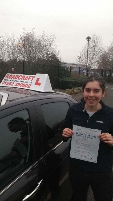 Roadcraft student holding driving test pass certificate