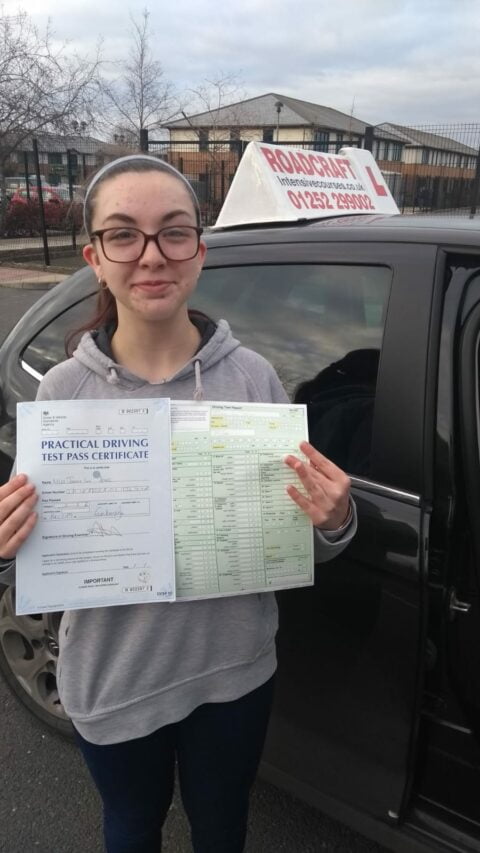 Roadcraft student holding driving test pass certificate