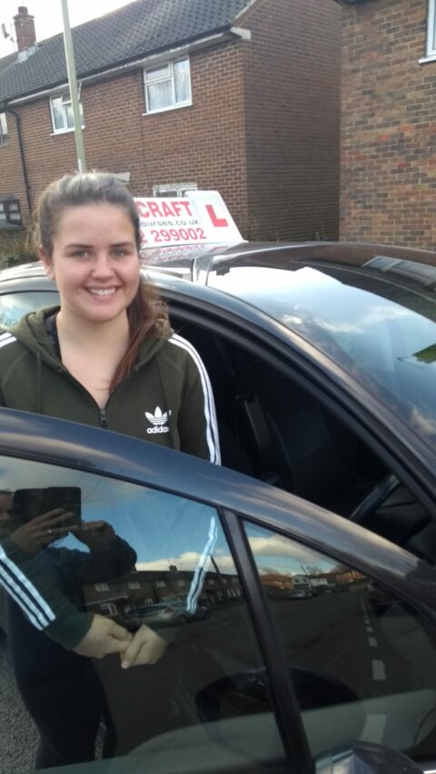 Roadcraft student holding driving test pass certificate