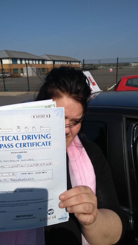 Roadcraft student holding driving test pass certificate