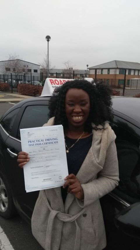 Roadcraft student holding driving test pass certificate