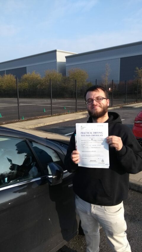 Roadcraft student holding driving test pass certificate