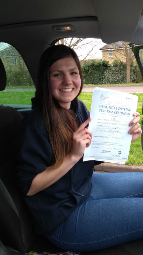 Roadcraft student holding driving test pass certificate
