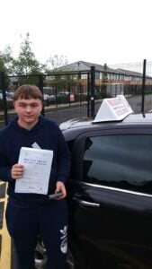 Roadcraft student holding driving test pass certificate