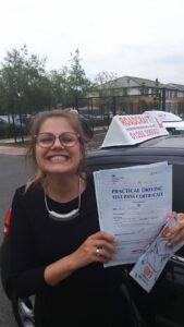 Roadcraft student holding driving test pass certificate