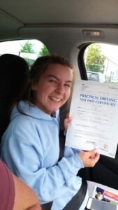 Roadcraft student holding driving test pass certificate