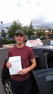 Roadcraft student holding driving test pass certificate