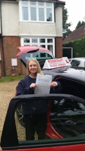 Roadcraft student holding driving test pass certificate