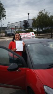 Roadcraft student holding driving test pass certificate