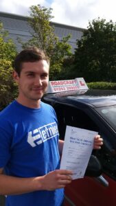 Roadcraft student holding driving test pass certificate