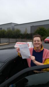Roadcraft student holding driving test pass certificate