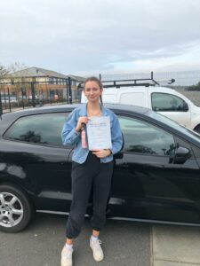 Roadcraft student holding driving test pass certificate