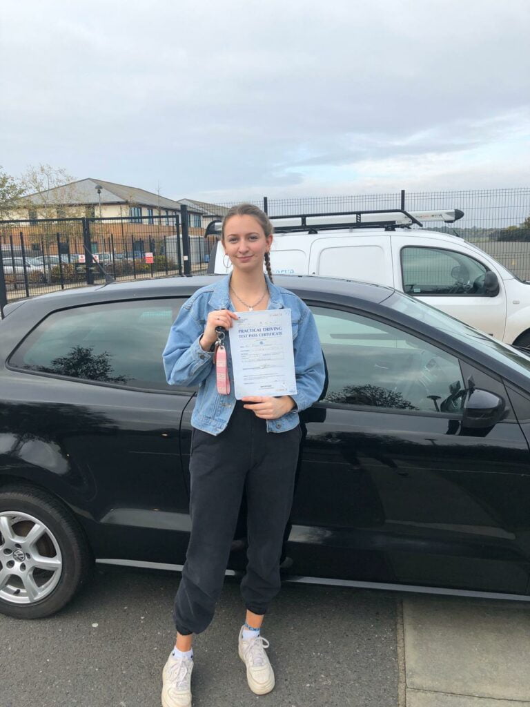 Roadcraft student holding driving test pass certificate