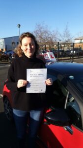Roadcraft student holding driving test pass certificate